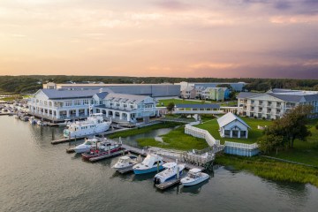 a boat is docked next to a body of water